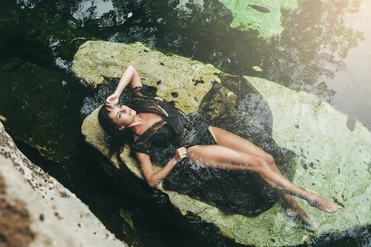 Beautiful woman lying in the water