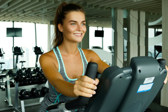 Happy woman in the gym