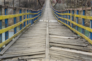 Rope suspension wooden bridge.