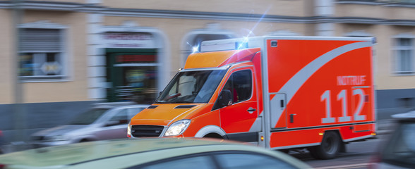 speeding german ambulance - obrazy, fototapety, plakaty