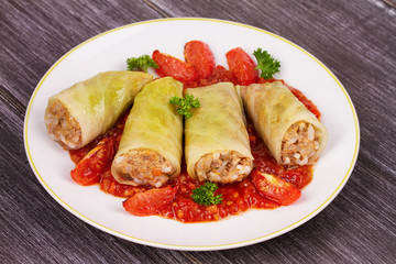 Cabbage rolls with meat, rice and vegetables in tomato sauce. Stuffed cabbage leaves with meat. Dolma, sarma, sarmale, golubtsy or golabki - traditional and popular dish in many countries