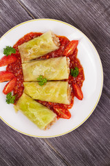 Cabbage rolls with meat, rice and vegetables in tomato sauce. Stuffed cabbage leaves with meat. Dolma, sarma, sarmale, golubtsy or golabki - traditional and popular dish in many countries