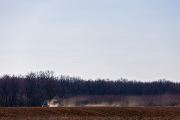 agricultural equipment in the field doing work spring