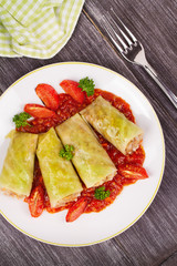 Cabbage rolls with meat, rice and vegetables in tomato sauce. Stuffed cabbage leaves with meat. Dolma, sarma, sarmale, golubtsy or golabki - traditional and popular dish in many countries