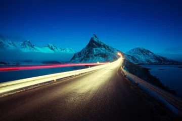 Schilderijen op glas Olstind Mount and car light. Lofoten islands? spring time, Norway © Iakov Kalinin