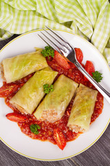 Cabbage rolls with meat, rice and vegetables in tomato sauce. Stuffed cabbage leaves with meat. Dolma, sarma, sarmale, golubtsy or golabki - traditional and popular dish in many countries