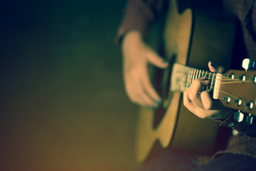 women playing acoustic guitar close-up,vintage tone