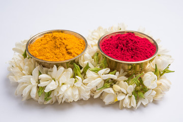 huldi kumkum or haldi-kumkum,indian hindu or punjabi woman applies on their forehead as an auspecious sign, also offered to god while prayer