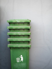 Stack of green trash bins