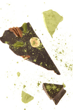 Black chocolate with almonds, hazelnuts, walnuts and pistachios and matcha powdered green tea