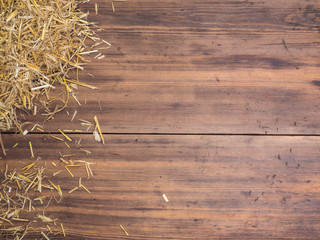 Rural eco background with and straw on the background of old wooden planks. The view from the top. Creative background for greeting cards, menu or advertising - obrazy, fototapety, plakaty