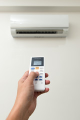 Fototapeta premium Air conditioner and remote control