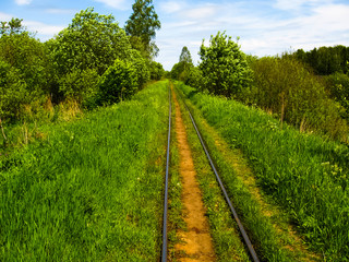 Fototapeta na wymiar Narrow-gauge railroad of peat enterprise 