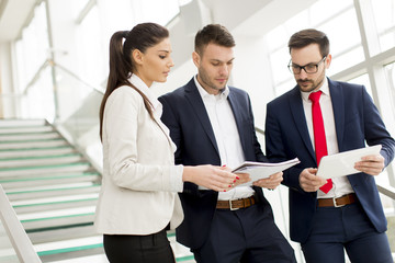 Business partners analyze the business results in modern office