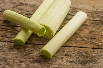cut leek on wooden background