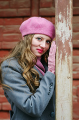 Portrait of a blond girl in a pink beret / The picture was taken in Russia, in the city of Orenburg, on Kobozev Street.