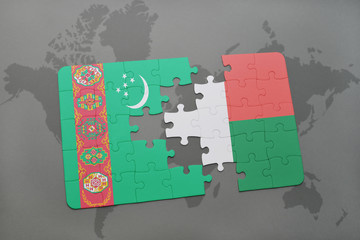 puzzle with the national flag of turkmenistan and madagascar on a world map