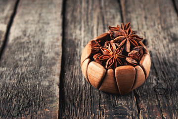 Anis in bowl, dark background