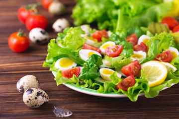 Letucce, cucumber, spinach, basil and quail eggs salad