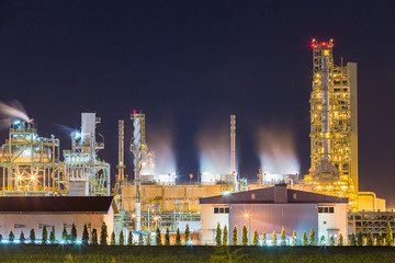 Fototapeta premium oil refinery and petrochemical plant with cooling tower in twili