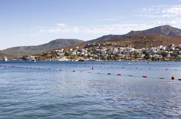 View of Turkbuku town and Aegean sea in Bodrum peninsula. It is a hot summer day photography.