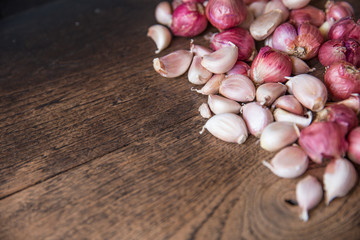 Garlic herbal healthy Thai food ingredient on dark wood background.