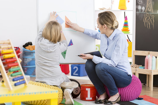 Girl Studying Maths With A Teacher