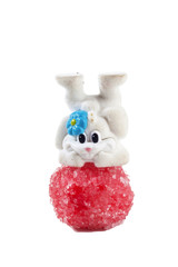 Bunny and candies together over a white background. Easter concept