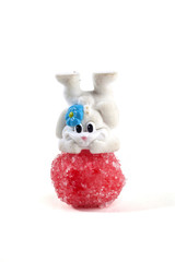 Bunny and candies together over a white background. Easter concept