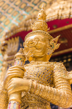 Closeup beautiful Golden Giant in Wat Phra Kaew or the Temple of the Emerald Buddha or Wat Phra Sri Rattana Satsadaram, Bangkok Thailand.