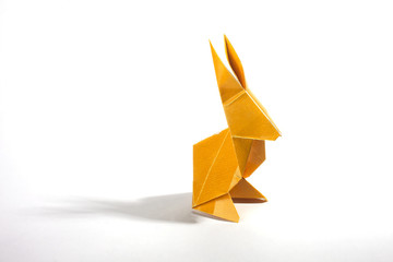 Origami rabbit over a white background