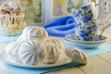 Marshmallow in a plate on a white background