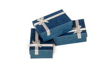 Dark blue gift boxes with silver ribbon isolated on white background