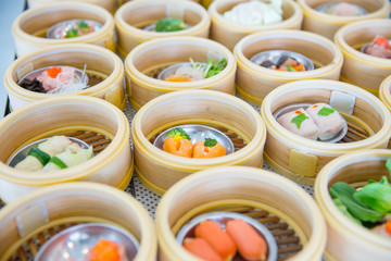 Yumcha or Dim sum, Chinese cuisine style steam food served in bamboo stack dish.