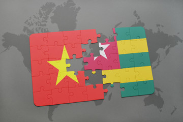 puzzle with the national flag of vietnam and togo on a world map