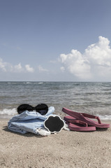 Summer background with flipflops and sunglasses