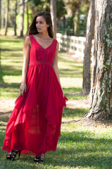 Woman in a red dress outside