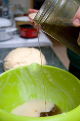 Creating and kneading the dough for gingerbread with honey