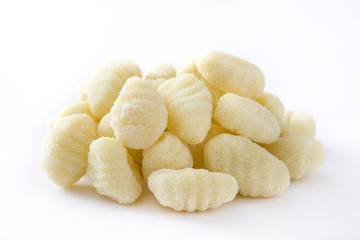 Uncooked potato gnocchi isolated on white background
