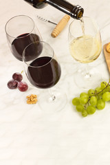 Wine poured into glasses at tasting, with copyspace