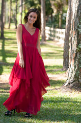 Woman in a red dress outside