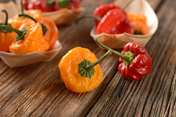 allspice red and yellow in the wooden bowl