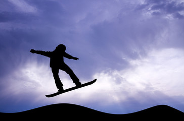Fototapeta na wymiar snowboarder silhouette at sunset