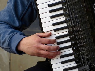Skilled hand on accordion keyboard