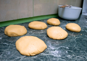 Fototapeta na wymiar Creating and kneading the dough for gingerbread