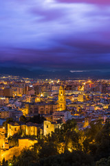 Malaga cathedral and cityscape at twilight