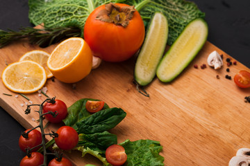 Frame of fresh vegetables on wooden background with copy space