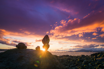 Fototapeta premium Rock balance with sunset sky backgrounds