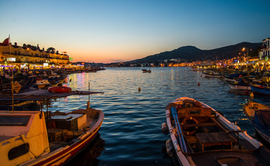 Foca, Turkey - September 29, 2013: Fishing boats at dawn in Foca town near Izmir, Turkey - obrazy, fototapety, plakaty