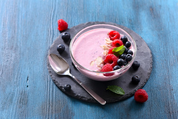 Smoothie bowl, pink smoothie with berries, healthy breakfast, vegan vitamin snack